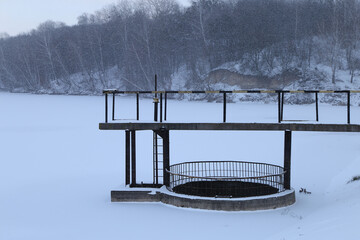 The construction at the lake in winter