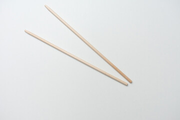 Wooden chopsticks, white background, copy space