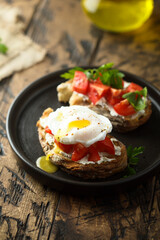 Homemade toast with tomato and poached egg