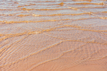 Soft wave of blue ocean on sandy beach