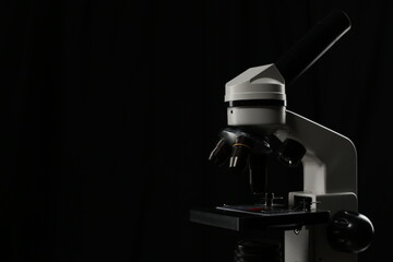 Medical microscope on black background