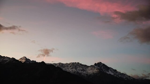 Time-lapse of dawn breaking over the snow capped peaks of Monte San Parteo and Monte Grosso in the Balagne region of Corsica