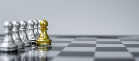 Gold Chess Pawn figure Stand out from the crowd on Chessboard background. Strategy, leadership, business, teamwork, different, Unique and Human resource management concept