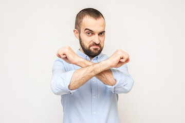 Brutal bearded man shows taboo gesture, white background