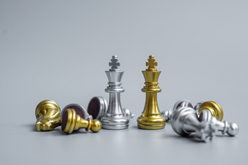 gold and silver Chess King figure stand out from crowd of enermy or opponent during chessboard competition. Strategy, Success, management, business planning, interruption, win and leadership concept