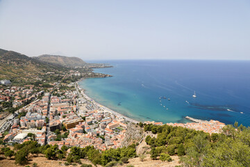 Fototapeta na wymiar Panoramic view of the beach. Cote d'Azur, ships at sea, small coastal town