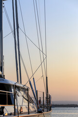 The silhouette of the ship and the match on the background of the sunset. Sunset a smooth transition from blue to orange