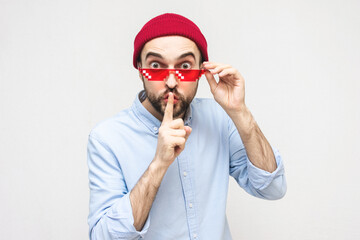 Funny bearded in pixel glasses says: Shhh, shut up, please. White background