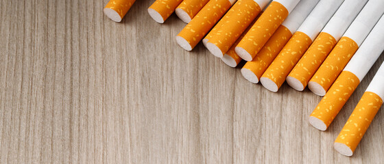 cigarettes. pile on wooden background. image of several commercially made or Non smoking campaign...