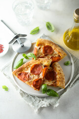Traditional pepperoni pizza with fresh basil