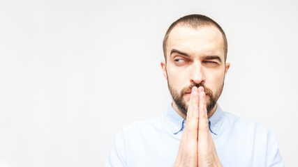 Sly bearden man prays, portrait, closeup, white background, copy space, 16:9