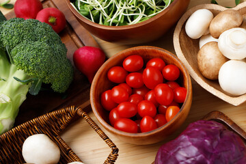 Tomatoes, shiitake mushrooms, broccoli, cabbage, ready to cook, in the kitchen.