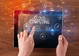 Close-up of a tablet with CLOUD COMPUTING inscription, innovative technology concept