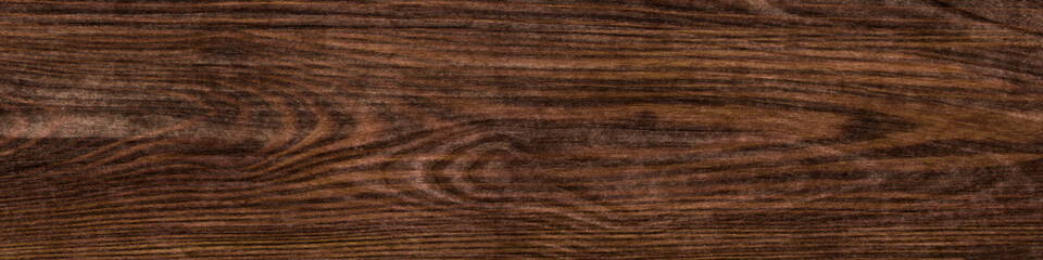 wenge oak, a flat surface of natural wood with a rich close-up pattern. plywood textured wooden background or wood surface of the old at grunge dark grain wall texture of panel top view. Vintage teak.