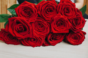 Red roses on wooden board, Valentines Day background