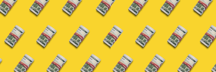 Money rolled into a tube. Pattern. Banner. Flat lay, top view