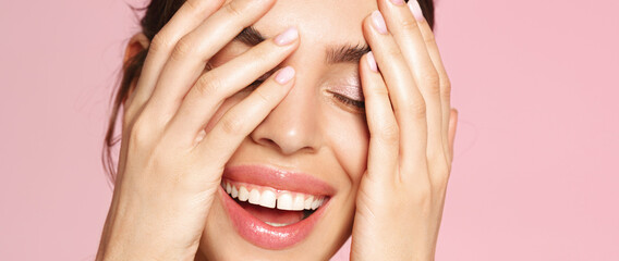 Skincare routine. Close up face of beautiful woman smiling and touching healthy well-nourished...