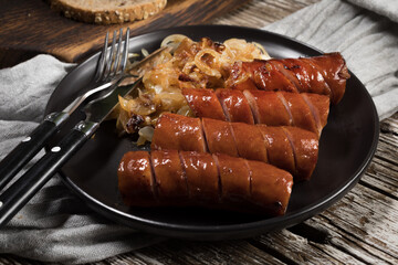 Fried sausage with onion.