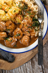 Minced meat balls in mushroom sauce.