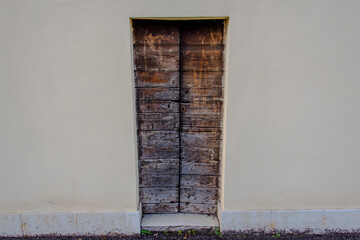 very narrow wooden door