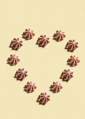 Romantic flat lay background of heart made of sweet soft candies for Valentine's day