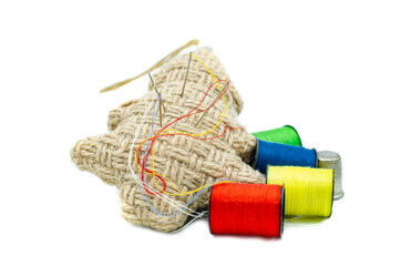 Needle pad and spool of colored thread