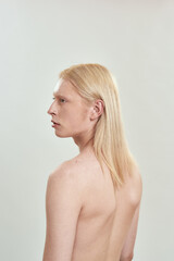 Young caucasian long haired blond male model naked