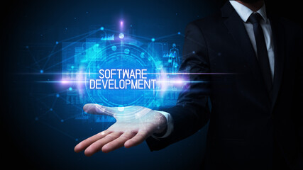 Fototapeta premium Man hand holding SOFTWARE DEVELOPMENT inscription, technology concept