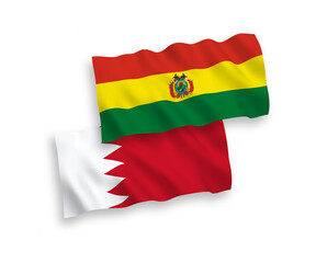 National vector fabric wave flags of Bolivia and Bahrain isolated on white background. 1 to 2 proportion.