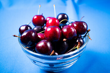 fresh cherries on light blue background
