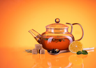 teapot on orange background