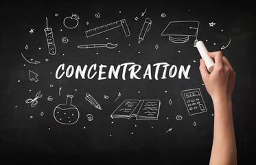 Hand drawing CONCENTRATION inscription with white chalk on blackboard, education concept