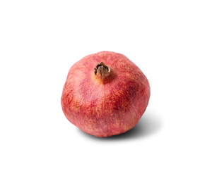 Natural organic pomegranate fruit with dry skin isolated on a white background.