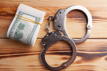 money and handcuffs bribery of the authorities