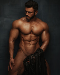 Fototapeta premium Studio portrait of naked hunk looking down