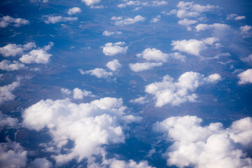 Naklejka na ściany i meble View of the clouds over Europe from the aircraft