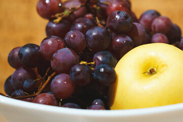 red grape and apple on plate