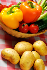 various vegetables like potatoes, garlic, onion, peppers, tomatoes in vintage style