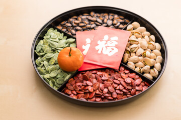 Lunar new year snack box, citrus fruit with red packet word means luck