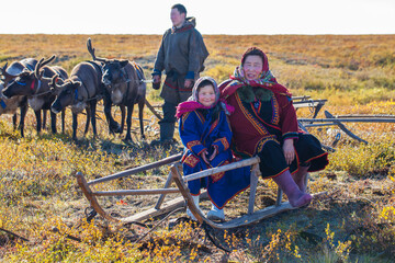 The extreme north, Yamal, the past of Nenets people, the dwelling of the peoples of the north, a family photo near the yurt in the tundra.