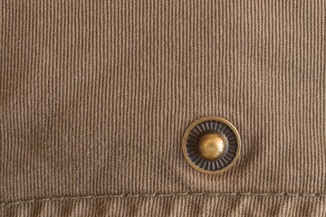 Fabric texture with rivets for clothes.