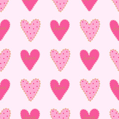 Seamless pattern hearts in rows on a soft pink background.