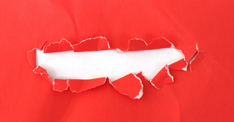 pieces of torn red hole paper texture background with copy space for text