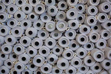 close-up of a folded grey fabric on a black background