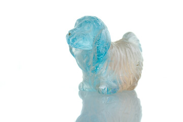 beautiful statuette of a dog from the mineral topaz on a white background