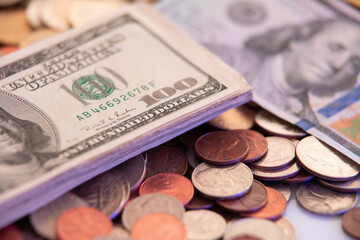 100 Dollar Bills on top of coins. USA Currency. Fiat Currency of the United States of America Treasury Department