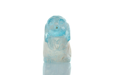 beautiful statuette of a dog from the mineral topaz on a white background