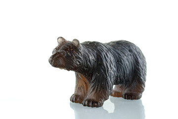 beautiful figurine of a bear made of smoky quartz on a white background
