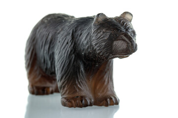 beautiful figurine of a bear made of smoky quartz on a white background