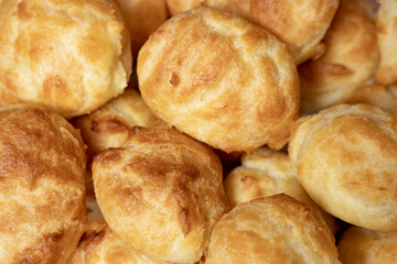 Fresh buns close-up as background.